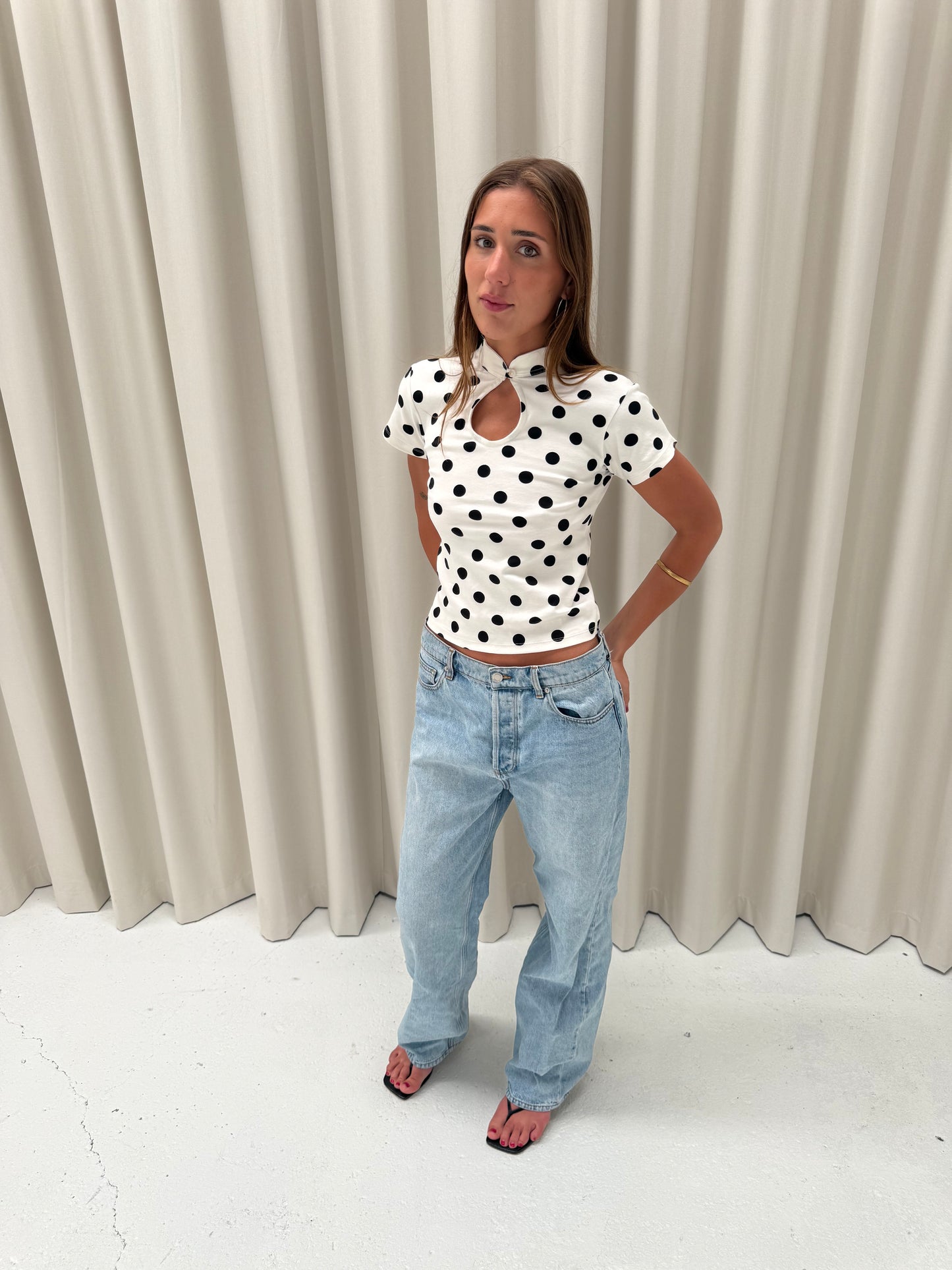 the lola top in white polka dot