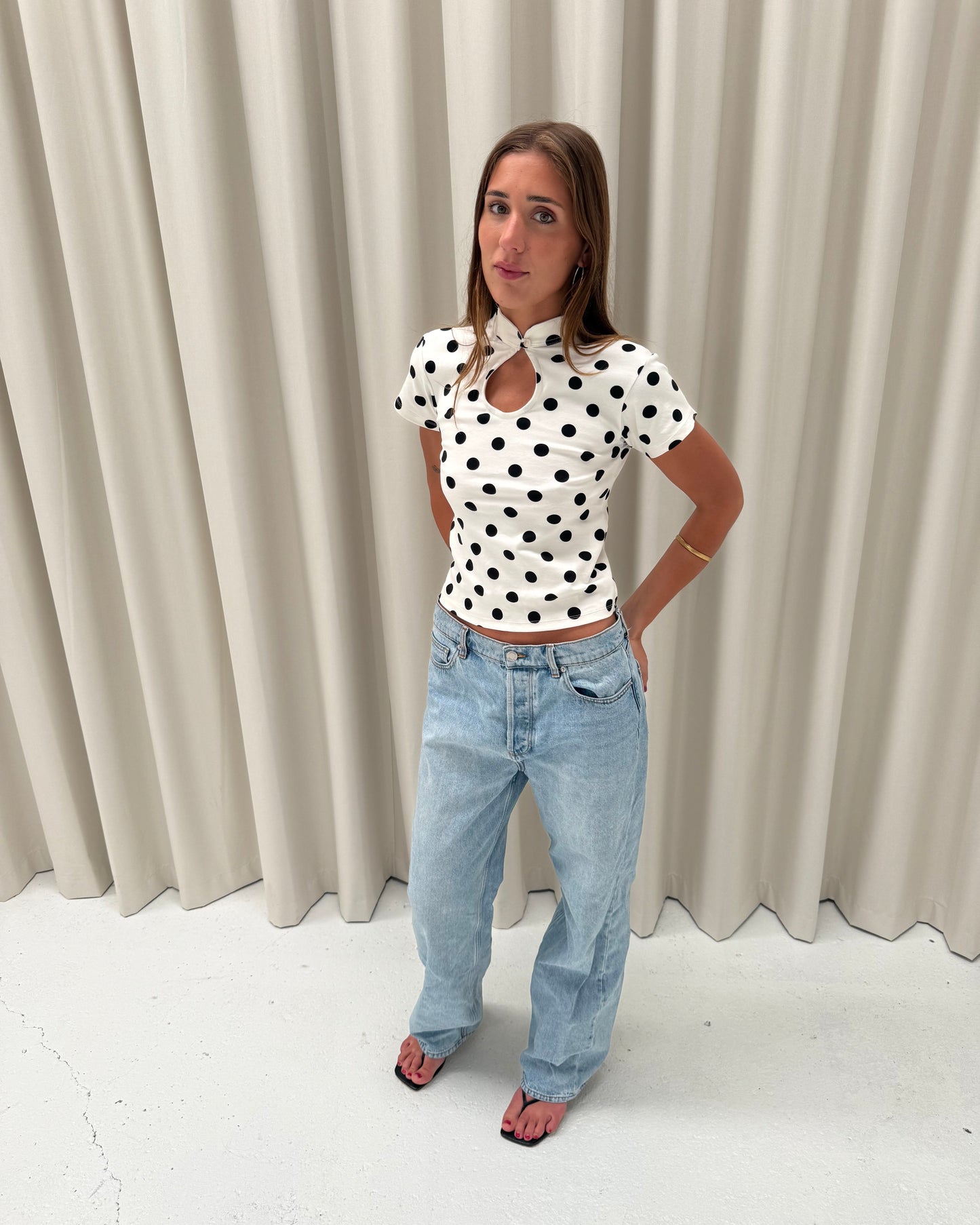 the lola top in white polka dot