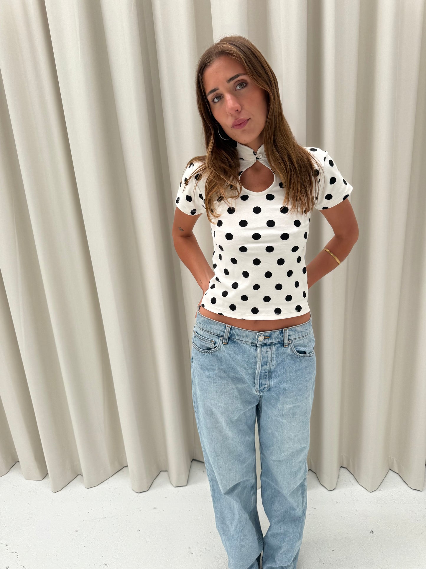 the lola top in black polka dot